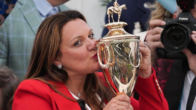 Golden Tempo trainer Cherie DeVaux kisses the trophy after the horse won the Kentucky Derby at Churchill Downs, May 2, 2026, in Louisville, Kentucky. 