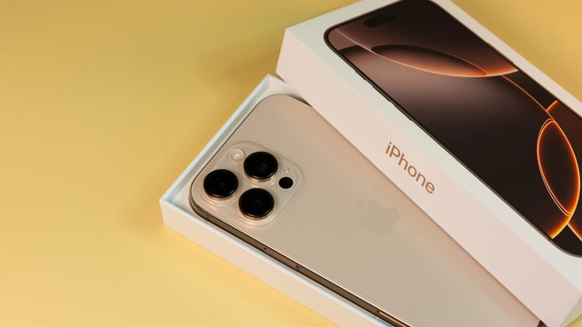 BURGAS, BULGARIA - NOVEMBER 30, 2025: Apple iPhone 16 Pro Max Desert Titanium on yellow background 