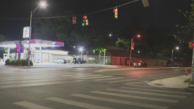 Flashing Lights and Police Tape Reading "Police Line Do Not Cross" 