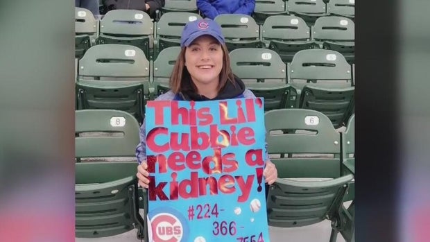 Bridgett Kolls holding sign 