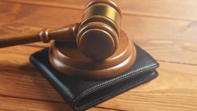 court gavel and wallet on the table 