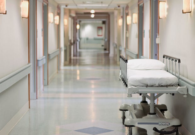 Portable hospital bed in hallway