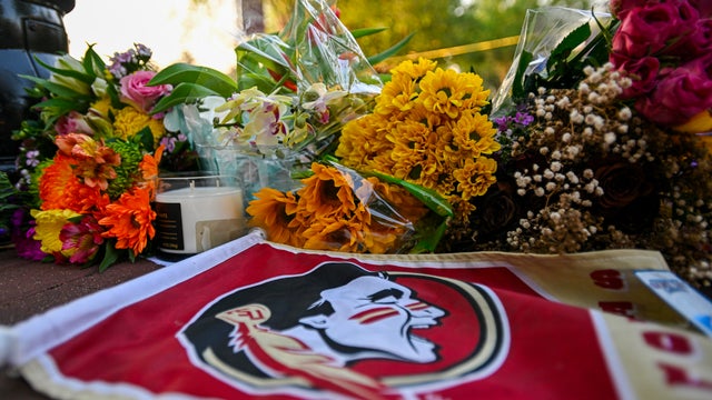 Students hold a vigil near the scene of a shooting near the Florida State University student center April 17, 2025, in Tallahassee, Florida. 