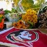 Students hold a vigil near the scene of a shooting near the Florida State University student center April 17, 2025, in Tallahassee, Florida. 