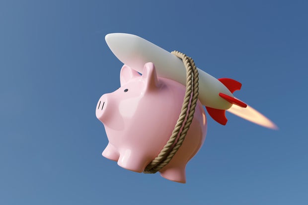 Pink piggy slope  carried by a rocket successful  wide   bluish  sky. Illustration of the conception  of skyrocketing prices of stocks and different   concern    