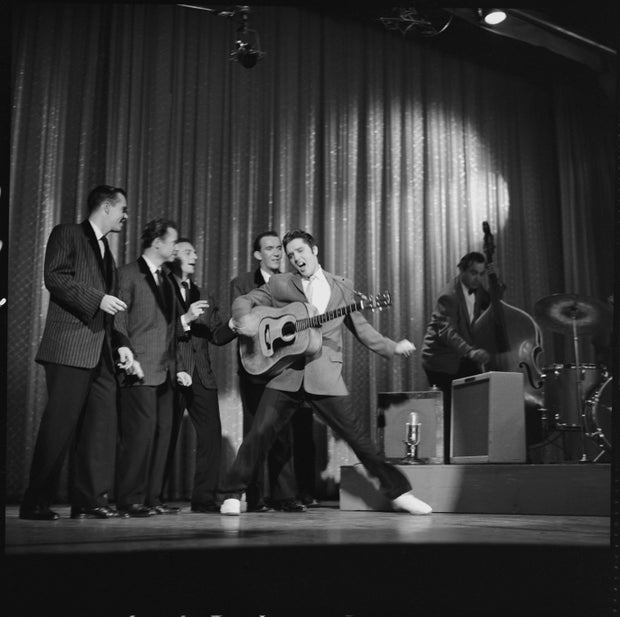 American rock and roll singer and actor Elvis Presley dances as he sings during his second appearance on the Ed Sullivan Show, New York, New York, October 28, 1956.