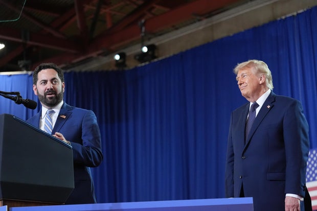 President Donald Trump listens as Rep. Mike Lawler, R-N.Y., speaks at Rockland Community College, Friday, May 22, 2026, in Suffern, N.Y. 
