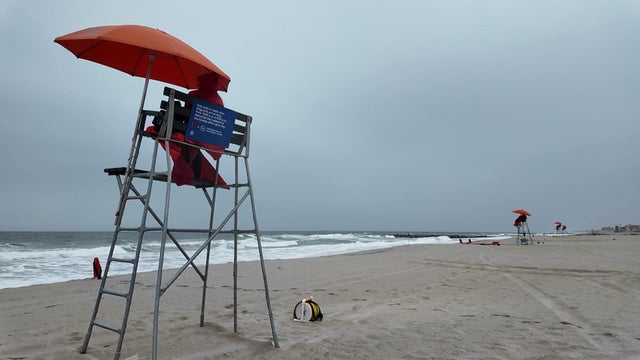 Lifeguards on an empty New York City beach 