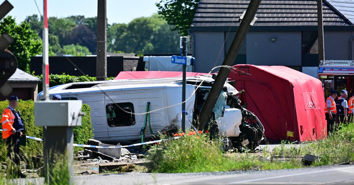 Train crashes into school minibus in Belgium, with deaths reported