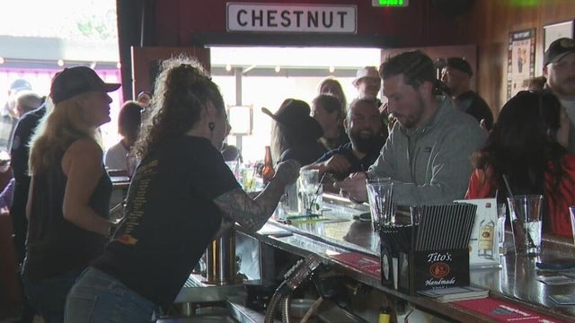a woman bartending 
