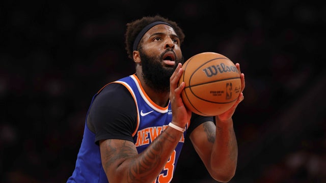 Mitchell Robinson #23 of the New York Knicks shoots a free throw against the Houston Rockets during the first quarter at Toyota Center on March 31, 2026 in Houston, Texas. 
