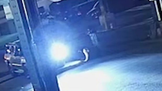 Men climbing into manhole in Brooklyn