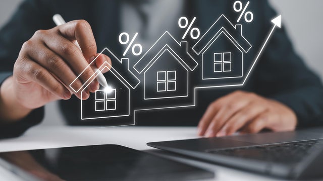 Interest rate and mortgage loan concept, Businessman analyze interests rate house increase trend follow up economic growth and inflation, Macroeconomics, real estate, income, marketing and profit. 