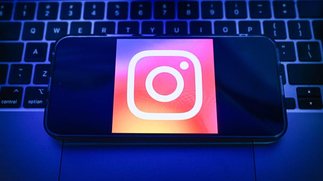 In this photo illustration, an Instagram logo displayed on a 
