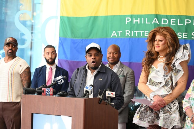 People post for photos at a Pride event at Sofitel Hotel in Philadelphia 