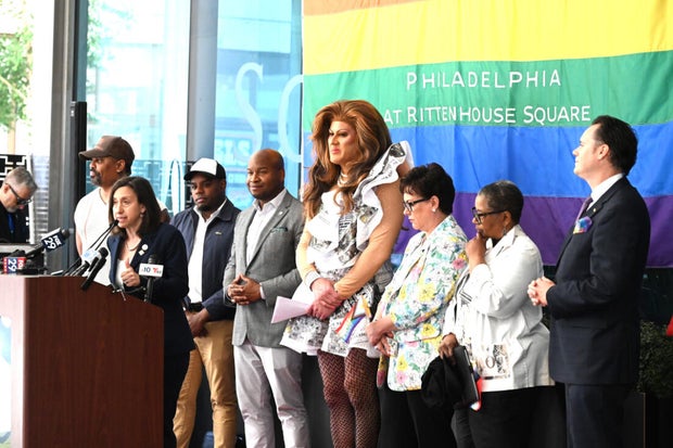 People post for photos at a Pride event at Sofitel Hotel in Philadelphia 