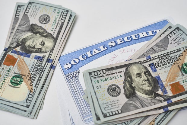 Social security card and us dollars cash money