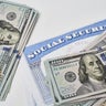 Social security card and us dollars cash money 
