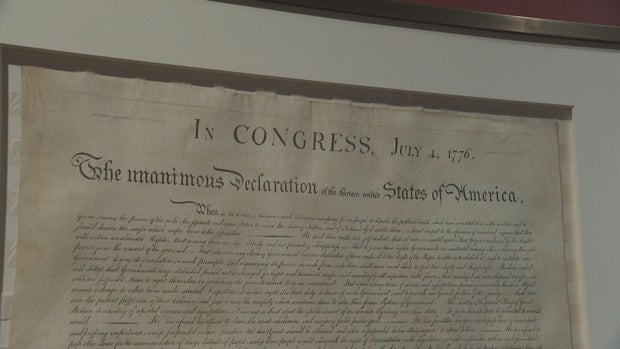 A photo of a framed copy of the Declaration of Independence from the museum 