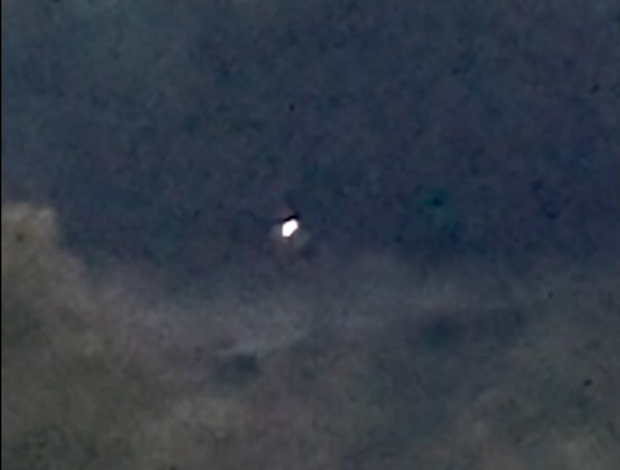 A frame from the "Orbs Over the Pond" video by an eyewitness, captured in October 2024 in the northeastern U.S.