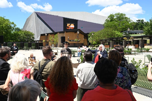 People celebrate the opening of the new Mann Center campus