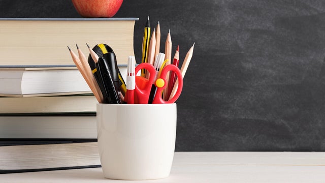 Classroom Essentials with Books, Pencils, and Apple 