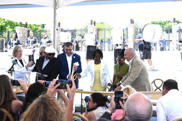 People celebrate the opening of the new Mann Center campus