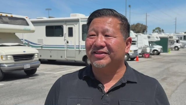Pastor Brian Leong stands in a safe parking site 