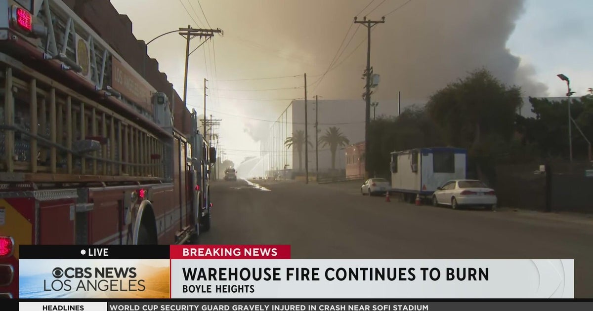 cbsnews.com - Iris  Salem - Firefighters confront flare-up at Boyle Heights warehouse