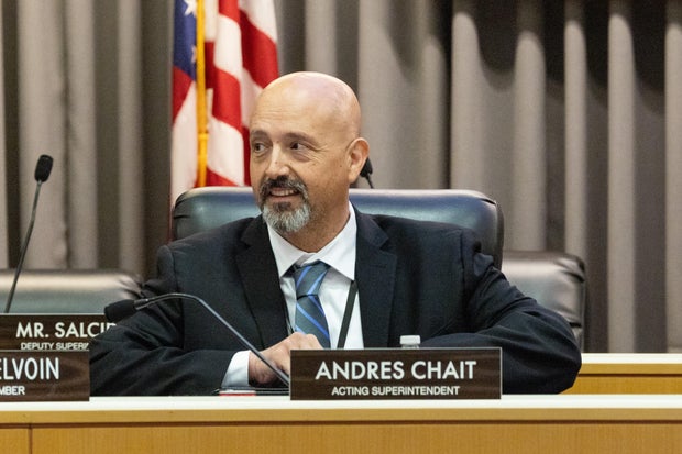 New acting superintendent Andres Chait attends a LAUSD board meeting as a full audience from the Locke high school Greendot charter, which is in danger of not being renewed looks on 