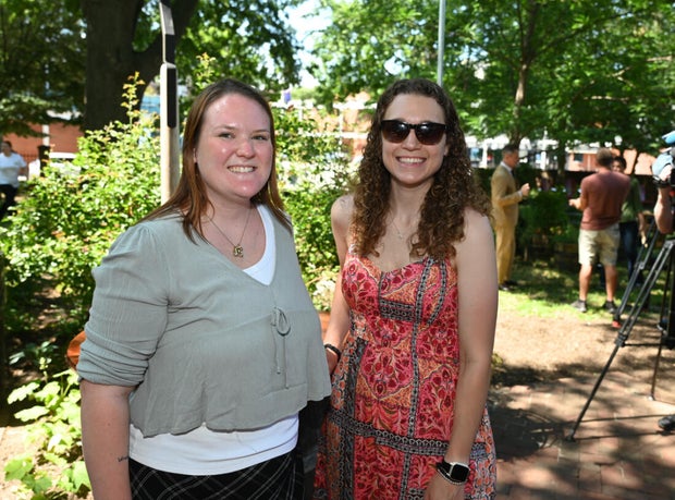 People pose for photos at City Tavern Garden 