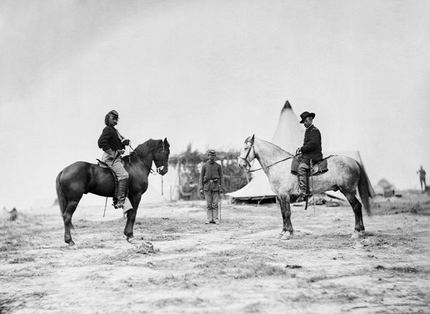 Captain George Armstrong Custer with Major General Alfred Pleasonton on horseback during American Civil War. 