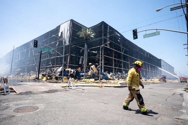 Lineage warehouse fire still buring after 7 days 