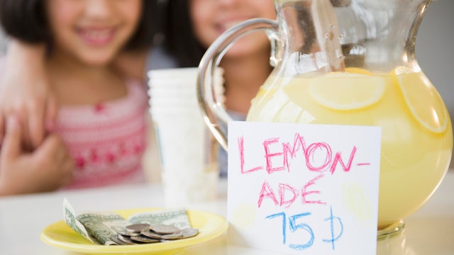 USA, New Jersey, Jersey City, Close up of two girl's (8-9, 10-11) selling lemonade 