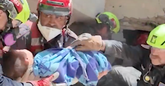Videos show U.S. rescue team pull mother, baby from rubble in Venezuela
