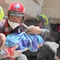 Videos show U.S. rescue team pull mother, baby from rubble in Venezuela
