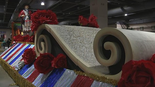 A float with a huge scroll and red, white and blue decorations for the parade 