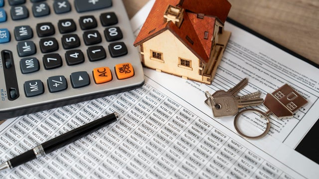 Money, pile coin with saving book and paper home,concept 