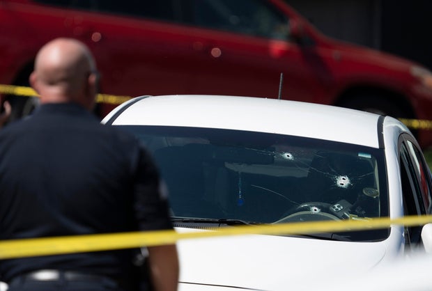 A Kia sedan with four bullet holes in the windshield is seen at the scene of a shooting in Biddeford, Maine, July 13, 2026. 