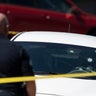 A Kia sedan with four bullet holes in the windshield is seen at the scene of a shooting in Biddeford, Maine, July 13, 2026. 