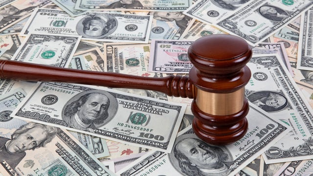 US-Dollar banknotes and gavel 