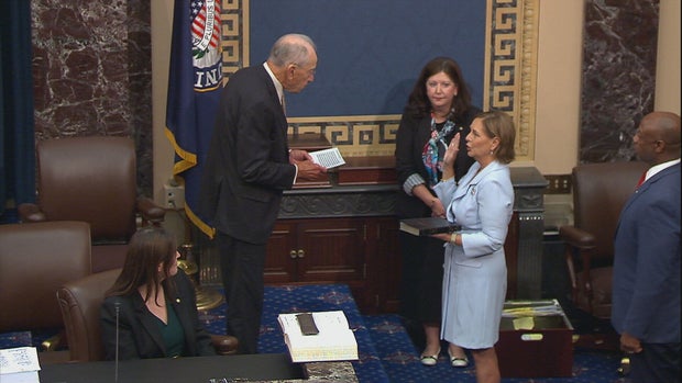 Sen. Chuck Grassley of Iowa administers the oath of office to Darline Graham, the sister of the late Sen. Lindsey Graham, on the Senate floor on Tuesday, July 14, 2026.
