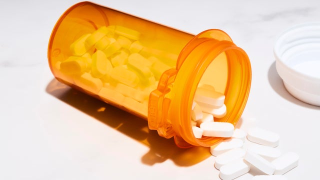 Pills spilled from a prescription bottle 