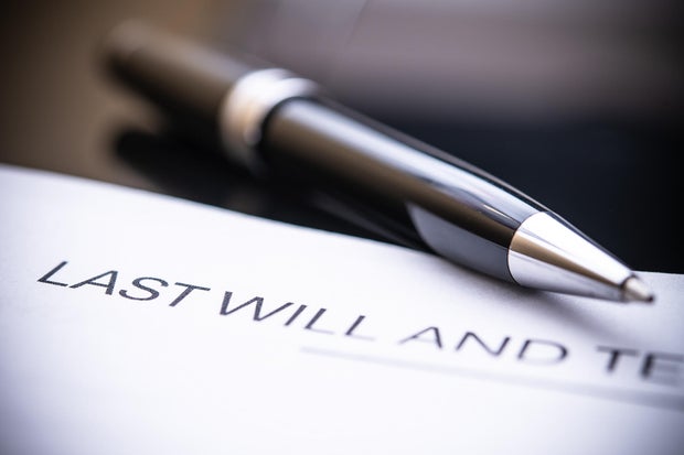 Last Will and Testament Document Close-Up with Elegant Pen on Black Background for Legal and Estate Planning Purposes 