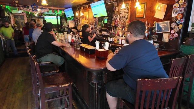 People watching a World Cup match at a bar 