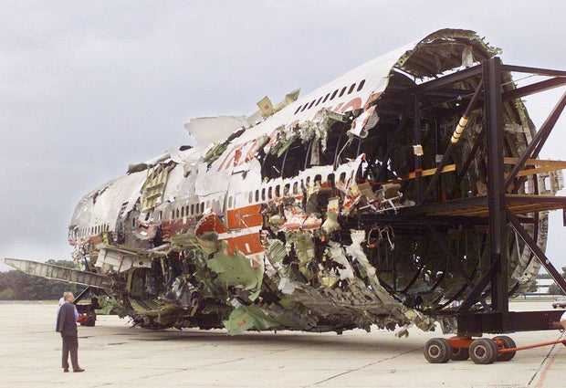 Jim Hall, chairman of the National Transportation Safety Board, looks on as the reconstruction of TWA Flight 800 is moved to a smaller hanger in Calverton, N.Y., Tuesday, Sept., 14, 1999.