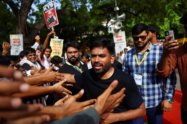 Abhijeet Dipke, head of the Cockroach Janta Party (CJP), addresses the supporters of the CJP during a protest demanding the resignation of Indian Education Minister Dharmendra Pradhan, in New Delhi 