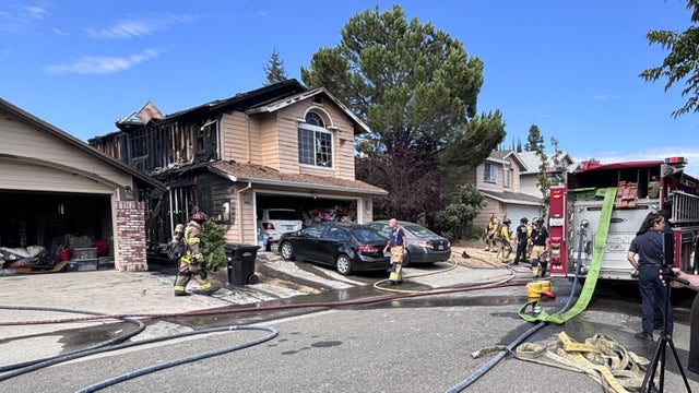 A fire between two homes left one with significant damage 