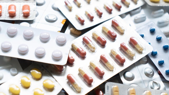 Background of a large group of assorted capsules, pills and blisters 