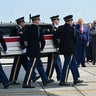 President Trump and Defense Secretary Pete Hegseth salute during a dignified transfer for Sgt. Angel S. Rampersad at Dover Air Force Base in Dover, Delaware, on July 22, 2026. 